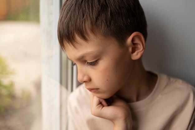 Free photo close up on sad boy portrait