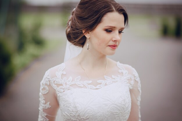 Close-up of sad bride with blurred background