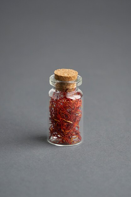 Close up on saffron in small bottle