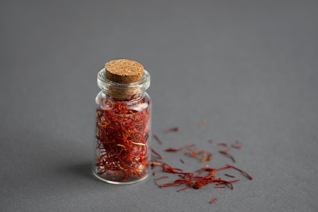 Close up on saffron in small bottle