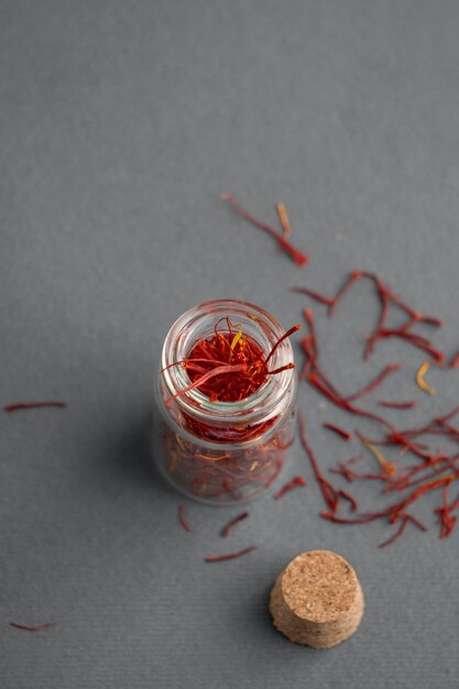 Close up on saffron in small bottle
