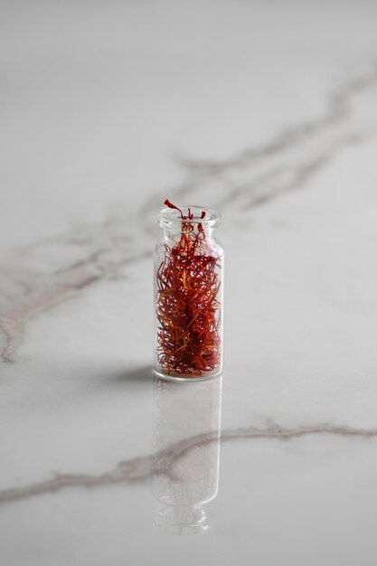 Close up on saffron in small bottle