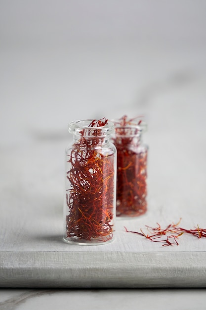 Close up on saffron in small bottles