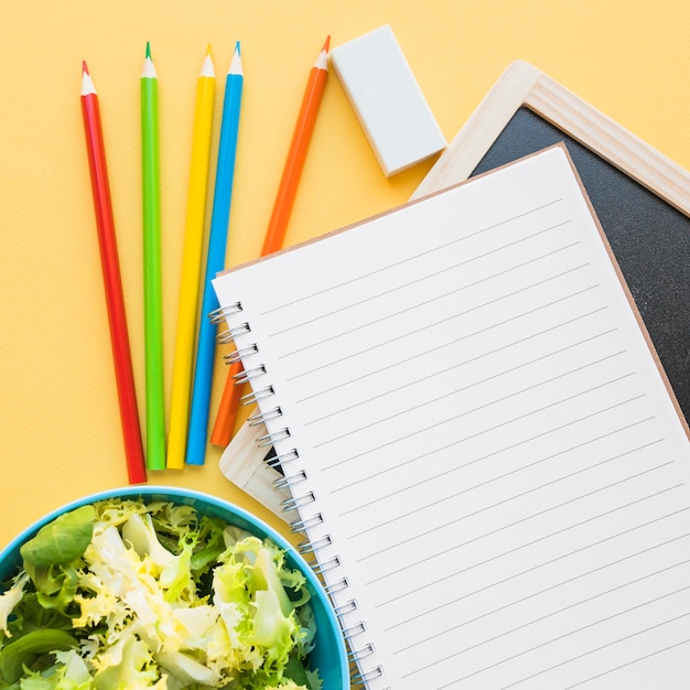 Close-up salad near stationery