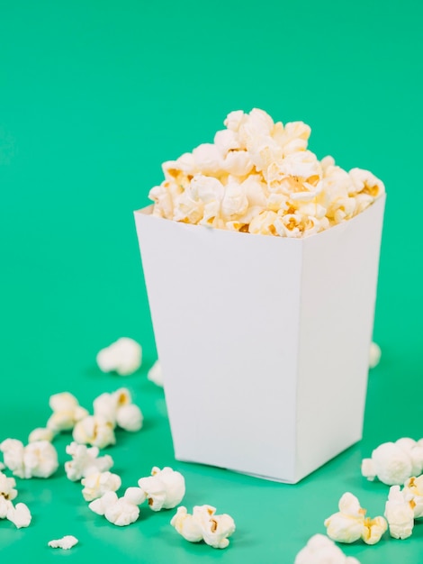 Close-up salted popcorn box on the table