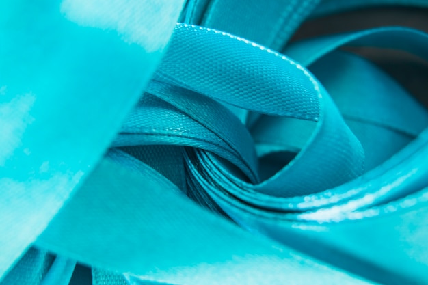 Free photo close-up of satin blue curled ribbon