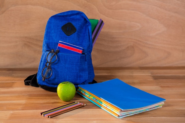 Close-up of school bag with books and stationery