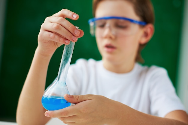 Close-up of schoolboy holding his discovery
