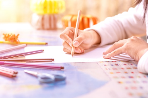 Free photo close-up of schoolgirl writing