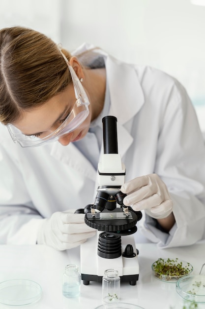 Close up scientist with microscope