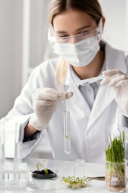 Close up scientist working with tube