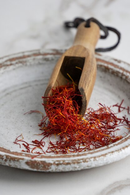 Close up on scoop full of saffron