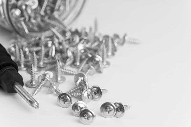 Free photo close-up screws on white table