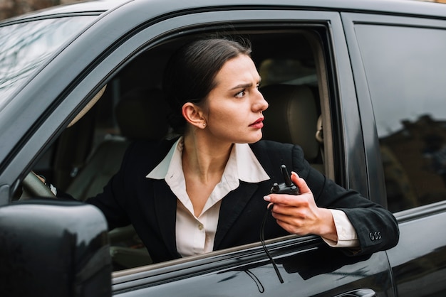 Close-up security woman in car