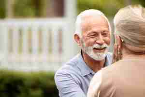 Free photo close up senior couple looking at each other