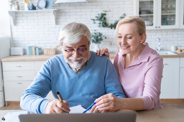 Close up on senior couple while learning