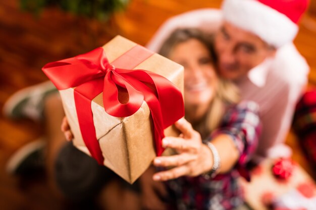 Close-up of senior couple with gift