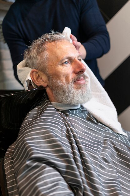 Close up senior man at hairdresser salon