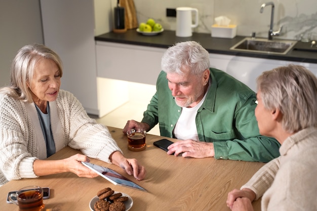 Close up senior people with tablet