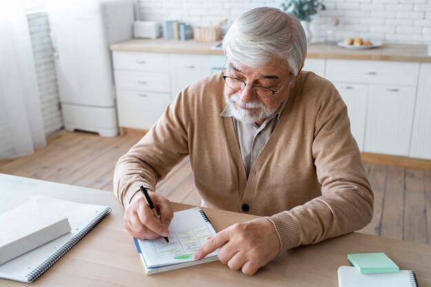 Close up on senior person while learning