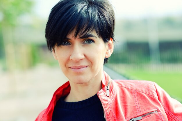 Close-up of serious woman with short hair