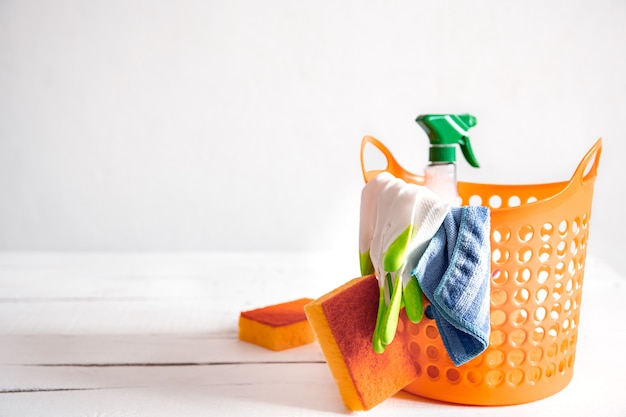 Free photo close up set of home cleaning products in a bright basket. means for maintaining cleanliness  background