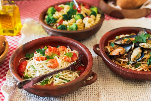 Close-up of several pastas on table
