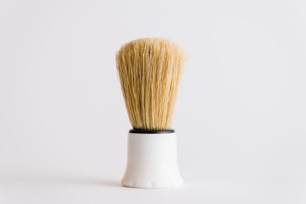 Close-up of shaving brush isolated on white background