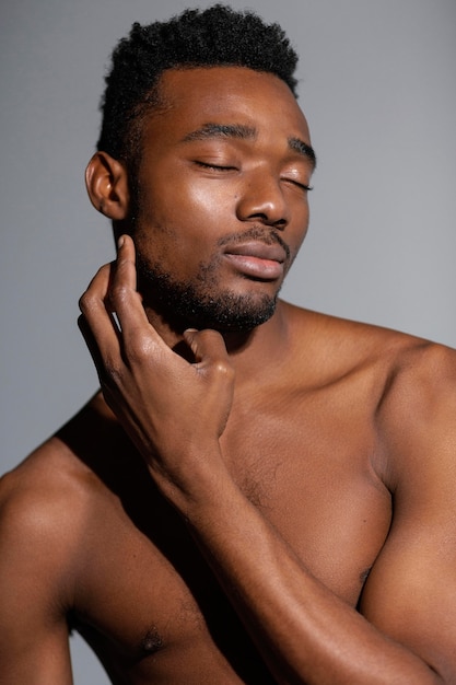 Close-up shirtless model posing