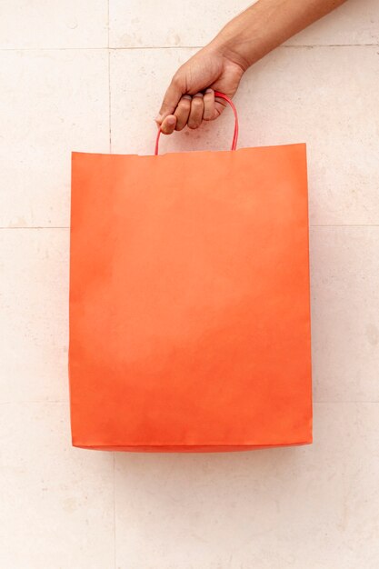 Close-up shopping bag holding by hand