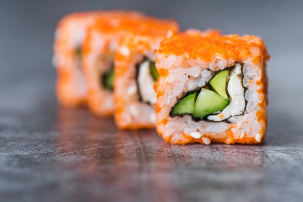 Close-up shot of arranged sushi rolls