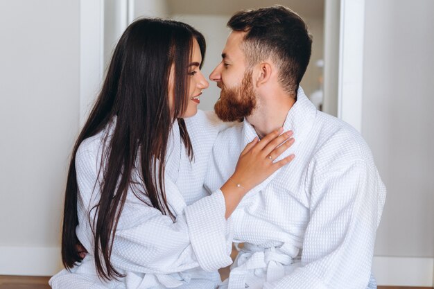 Close up shot of attractive woman leaning on the handsome guy