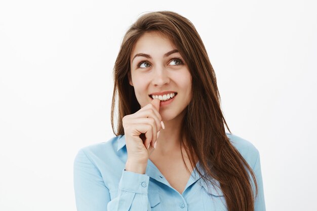 Close-up shot of beautiful creative brunette businesswoman posing in the studio