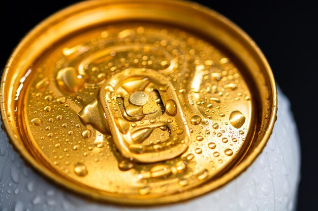 Close-up shot of a beer metallic can with some water drops