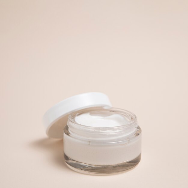 Close-up shot of body cream with plain background