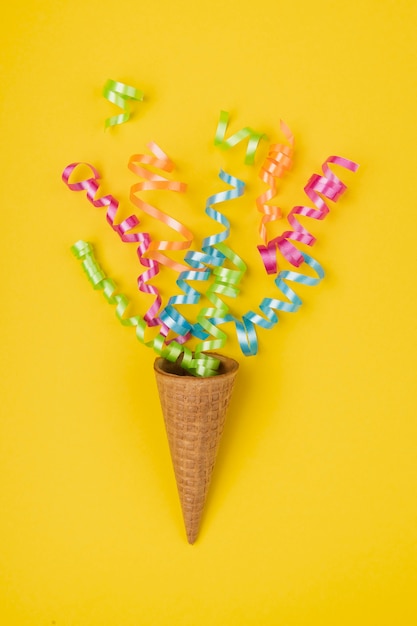 Close up shot confetti popping out of ice-cream cone