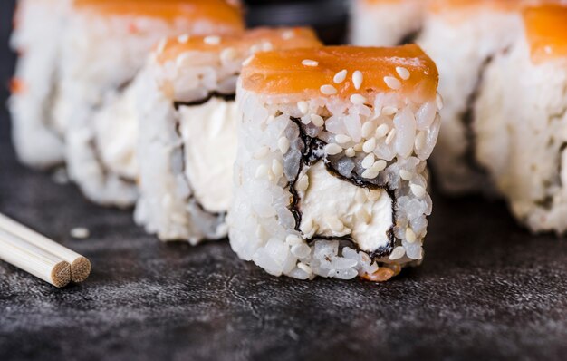 Close-up shot of a sushi roll with seeds