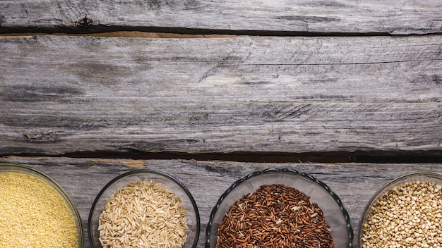 Free photo close up shot of various types of  fresh grains in small glass bowls