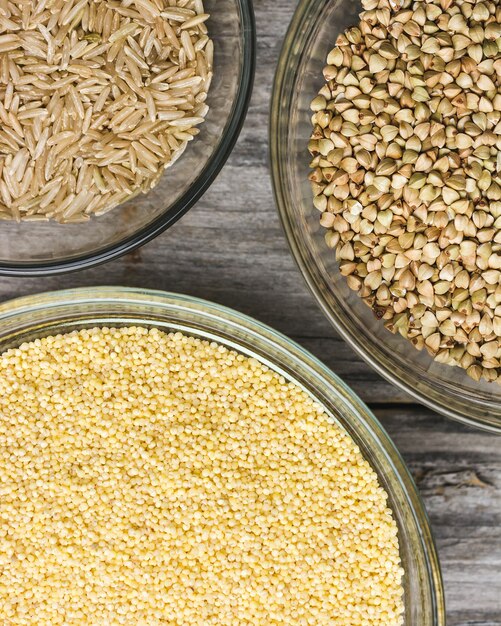 Close up shot of various types of  fresh grains in small glass bowls