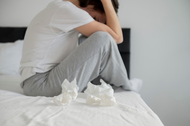 Close up sick woman in bed