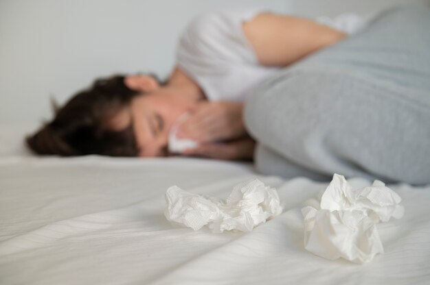Close up sick woman in bed