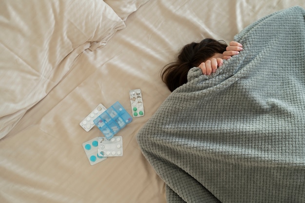 Free photo close up sick woman covering with blanket