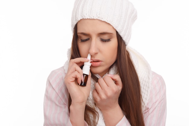Close-up of sick woman with blocked nose