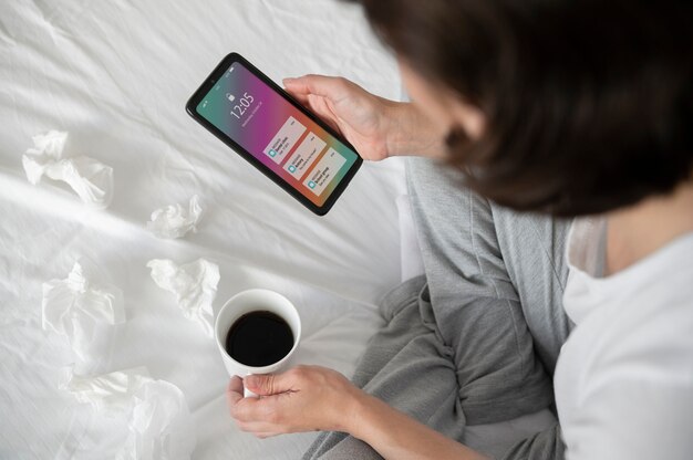 close up sick woman with smartphone