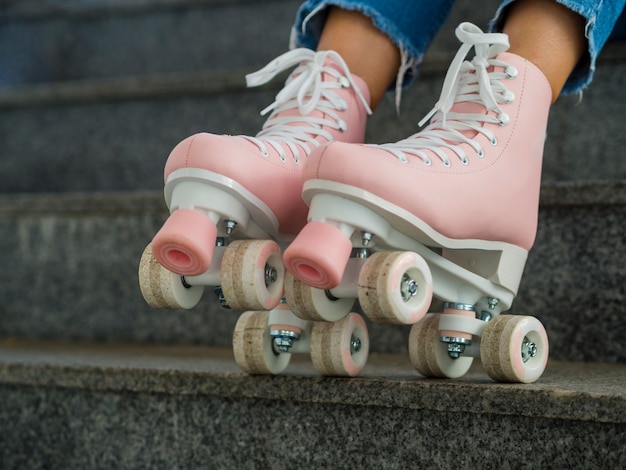 Close-up of side view of roller skates and stairs