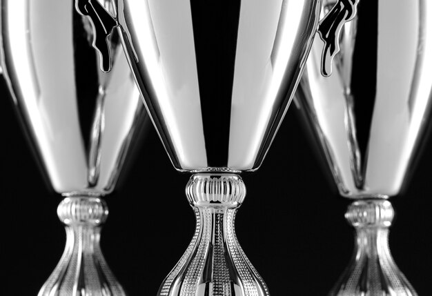 Close-up of silver cup trophies