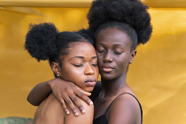 Close up sisters posing together