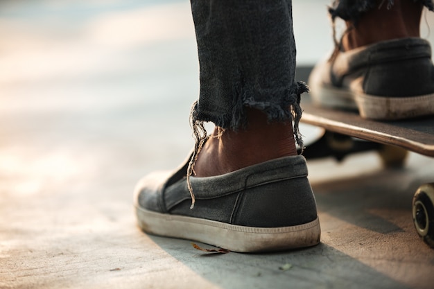 Close up of skateboarders feet standing