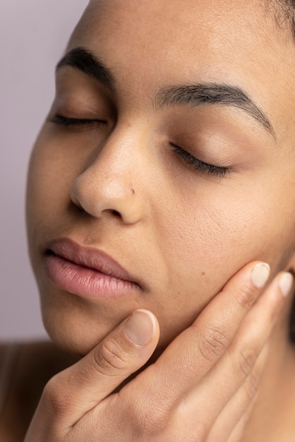 Close up on skin pores during face care routine