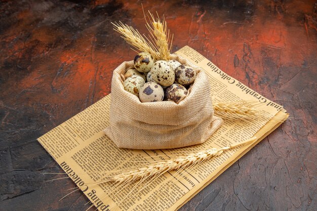 Close up on small fresh eggs in wooden bowl